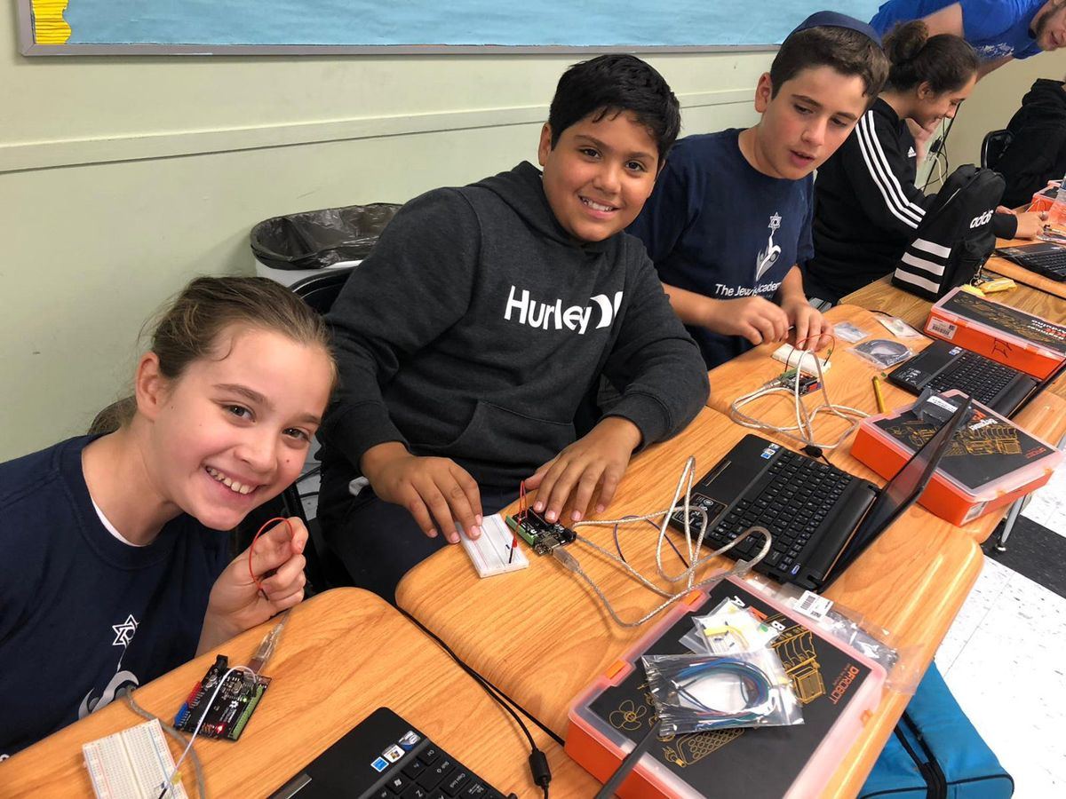 Students with robotics